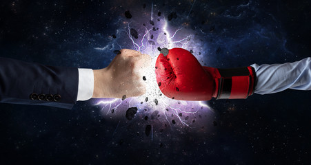Obraz na płótnie Canvas Two hands fighting with storm explosion concept