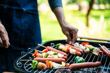 BBQ grilled party at outdoor garden hand close up