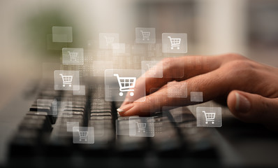 Business woman hand typing on keyboard with online shopping concept