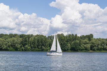 Sailboat on river. Beautiful summer landscape.