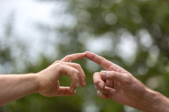 Two Hands Touching, Two Men Touch Their Finger, Concept The Global Gender Gap Report