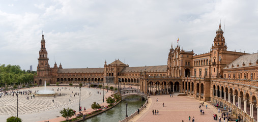 Fototapeta premium The Plaza de España is a plaza in the Parque de María Luisa, in Seville, Spain, built in 1928 for the Ibero-American Exposition of 1929 and was inspired by Renaissance Revival Mudéjar styles.