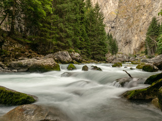 small river in the mountains, slow shutter speed for smooth water level and dreamy effect