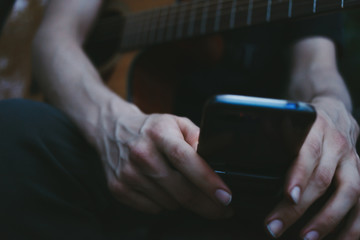 Smartphone. Close up of a man's hands using mobile phone.