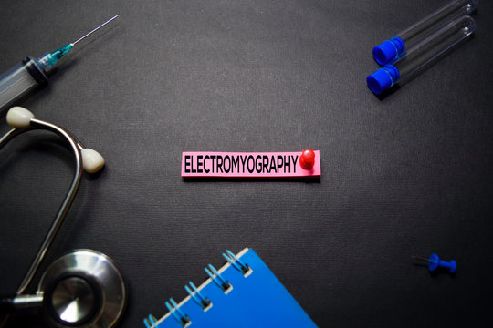 Electromyography text on Sticky Notes. Top view isolated on black background. Healthcare/Medical concept