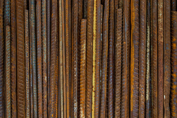 Top view stack of straight old rusty high yield stress deformed reinforcement steel or iron bars....