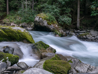 small river in the mountains, slow shutter speed for smooth water level and dreamy effect