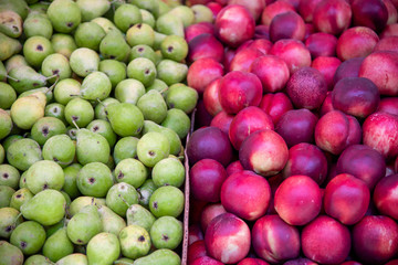 Close-Up Of Nectarine Peaches and Pears for sale at market stall. Carmel Market, Tel Aviv, Israel