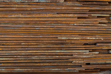 Top view stack of straight old rusty high yield stress deformed reinforcement steel or iron bars....