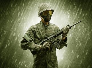 Armed soldier standing in rainy weather