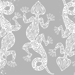 Vector drawing of a lizard or salamander with ethnic patterns of Aboriginal Australia. On the grange background. Image salamandy as a tattoo.