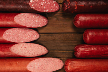 smoked sausage on wooden background
