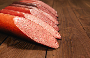smoked sausage on wooden background