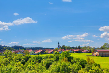 Fototapeta na wymiar German village with green field