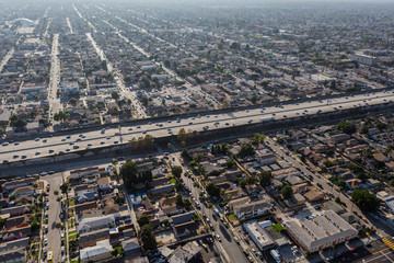 Aerial view of buildings, homes and streets near the Harbor 110 freeway south of downtown Los...