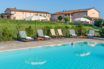 Lovely view of the pool of a tourist resort in the countryside of Pisa, Tuscany, Italy