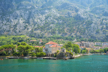Beautiful view of the seaside town at the foot of the mountain on a sunny day on the coast of the...