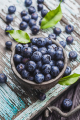 ripe blueberry berries on old wooden table. healthy food