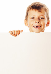 little cute boy holding empty shit to copyspace isolated close up gesturing smiling