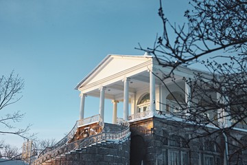 Fototapeta na wymiar White building with classical columns and blue sky