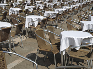 Gastronomy in Venice, tables and chairs at St Mark square