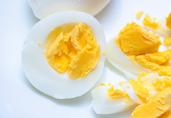 Closeup to an egg cut it, yellow and white
