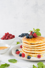 American pancakes with fresh berries and honey