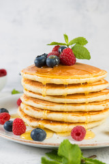 American pancakes with fresh berries and honey
