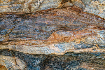 colorful alpine rocks with minerals texture