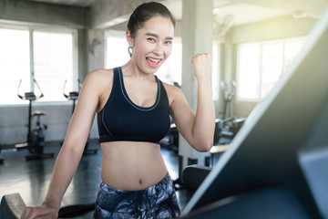 Women running on tread mill in sport club