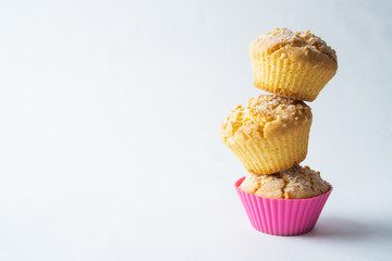 Tasty baked muffins on a light background, minimalism, a place for an inscription