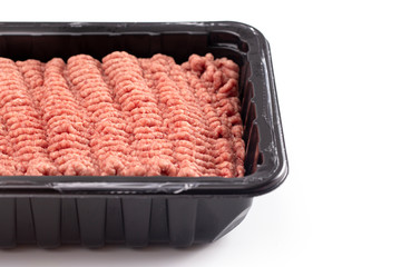 Raw Hamburger Meat in a Plastic Package on a White Background