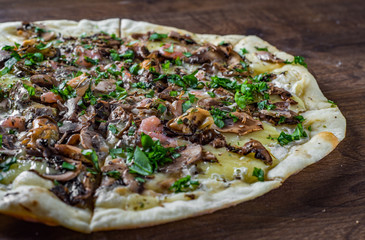 Seafood Pizza - Marinara. Pizza with Mozzarella cheese, shrimps, mussels, mushrooms, tomato sauce, pepper. Italian pizza on wooden table background