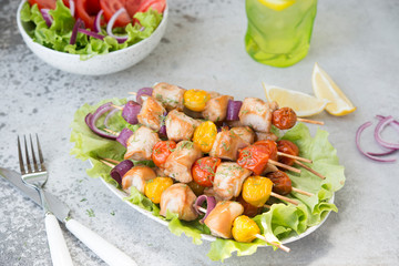 Chicken kebabs with vegetables on skewers