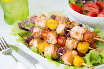 Chicken kebabs with vegetables on skewers