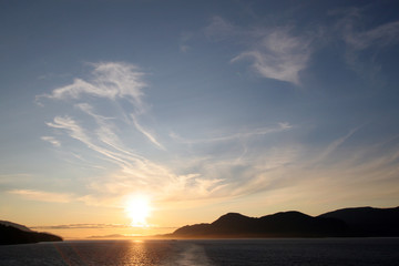 Sunset over the tranquil water of the Inside Passage, Alaska.