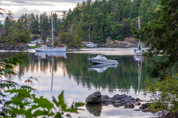 View over Inlet, ocean and island with boat and rocks in beautiful British Columbia. Canada.
