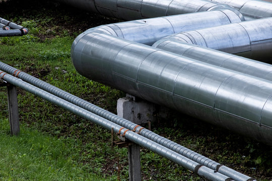 Metal Water Pipes Above The Ground Close Up