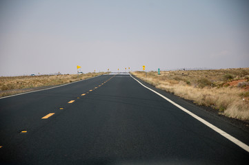 Fototapeta na wymiar Road leading to a curve in USA
