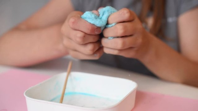 child making slime - step by step guide. playing with slime.