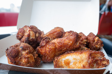 Grilled wings in a box. Shallow depth of field