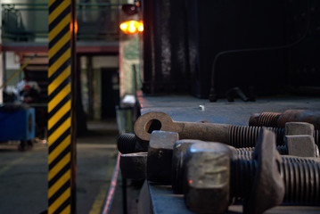 Trains bolts in a workshop.
