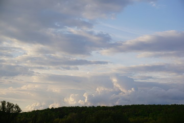 Fototapeta na wymiar beautiful clouds over the forest