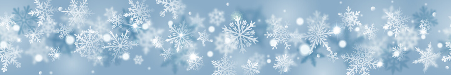 Naklejka na ściany i meble Christmas banner of complex blurred and clear snowflakes in white colors on light blue background. With horizontal repetition