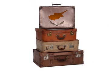 Cyprus, Cyprian travel concept. Group of vintage suitcases isolated on white background.