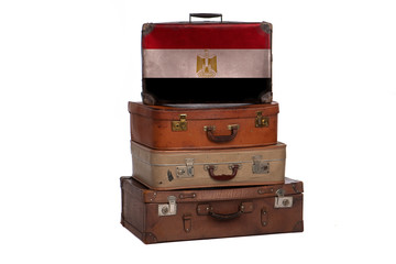 Egypt, Egyptian travel concept. Group of vintage suitcases isolated on white background.