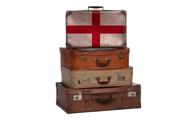 England, English travel concept. Group of vintage suitcases isolated on white background.