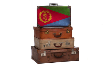 Eritrea travel concept. Group of vintage suitcases isolated on white background.