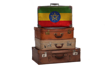 Ethiopia, Ethiopian travel concept. Group of vintage suitcases isolated on white background.