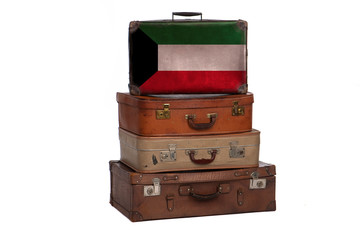 Kuwait, Kuwaiti travel concept. Group of vintage suitcases isolated on white background.